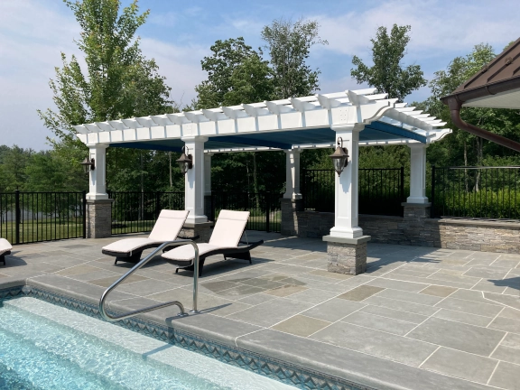 Poolside fiberglass pergola with canopy in Connecticut