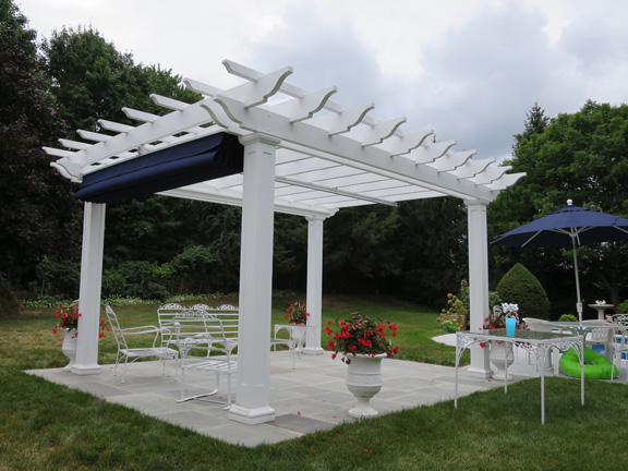 Poolside fiberglass pergola with canopy in Connecticut