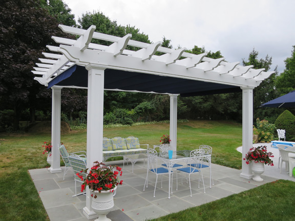 Poolside fiberglass pergola with canopy in Connecticut