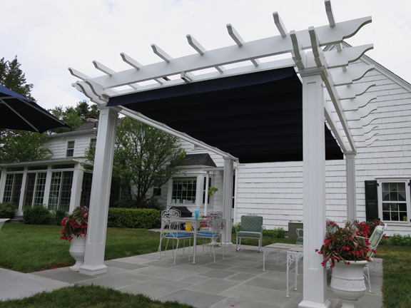 Poolside fiberglass pergola with canopy in Connecticut