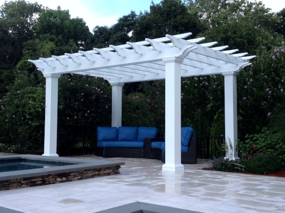 A simple pergola beside a pool