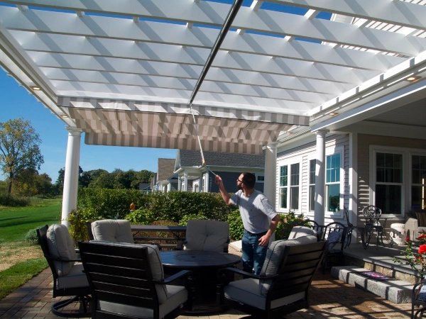 A fiberglass pergola with an overhead shade