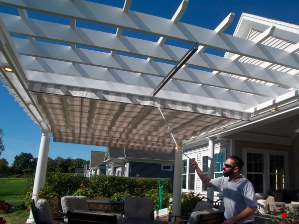 A fiberglass pergola with an overhead shade